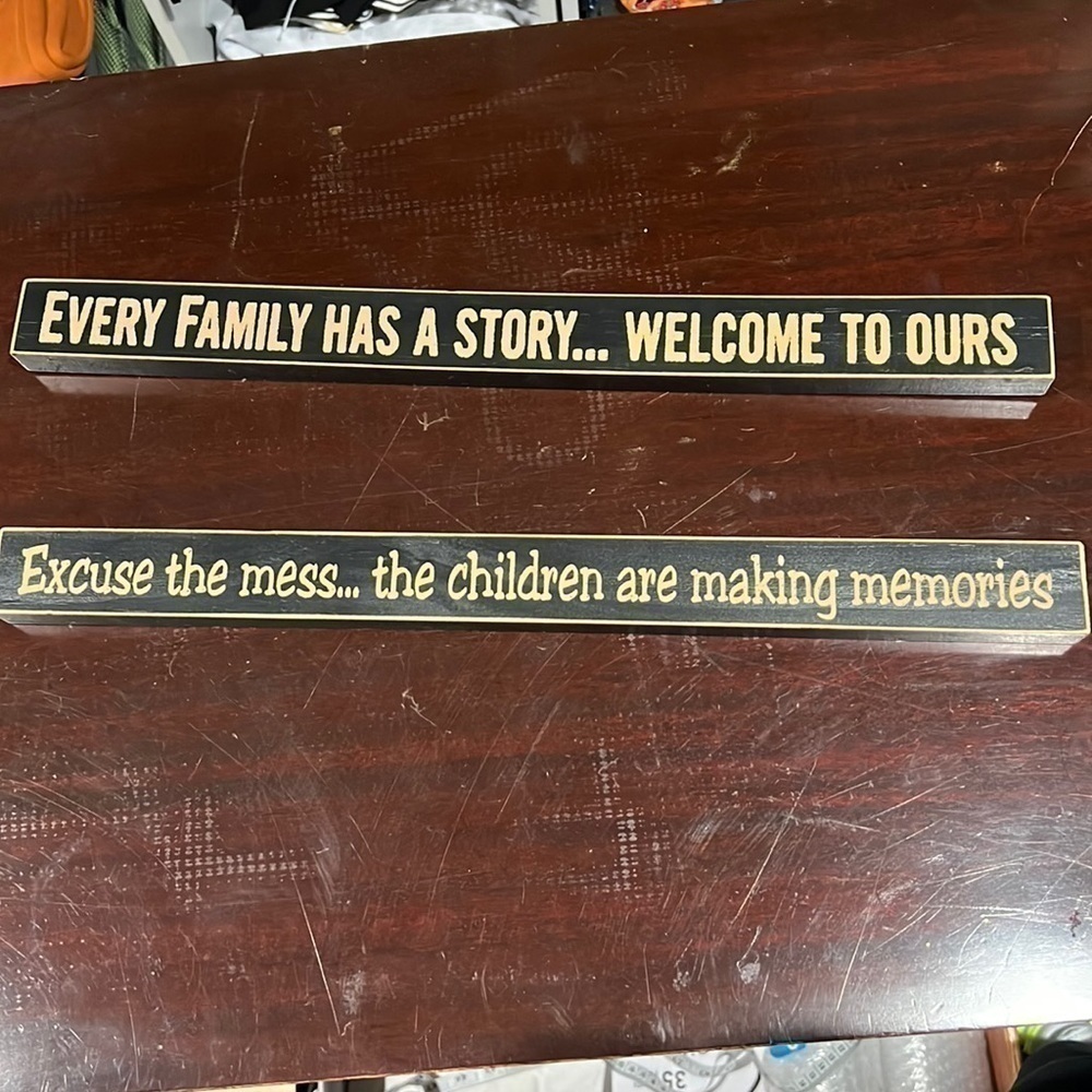 Three wooden saying decor pieces.